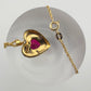 Elegant and Eye Catching Ruby Heart with Round and Baguette White Sapphires Surrounding - BEAUTIFUL!