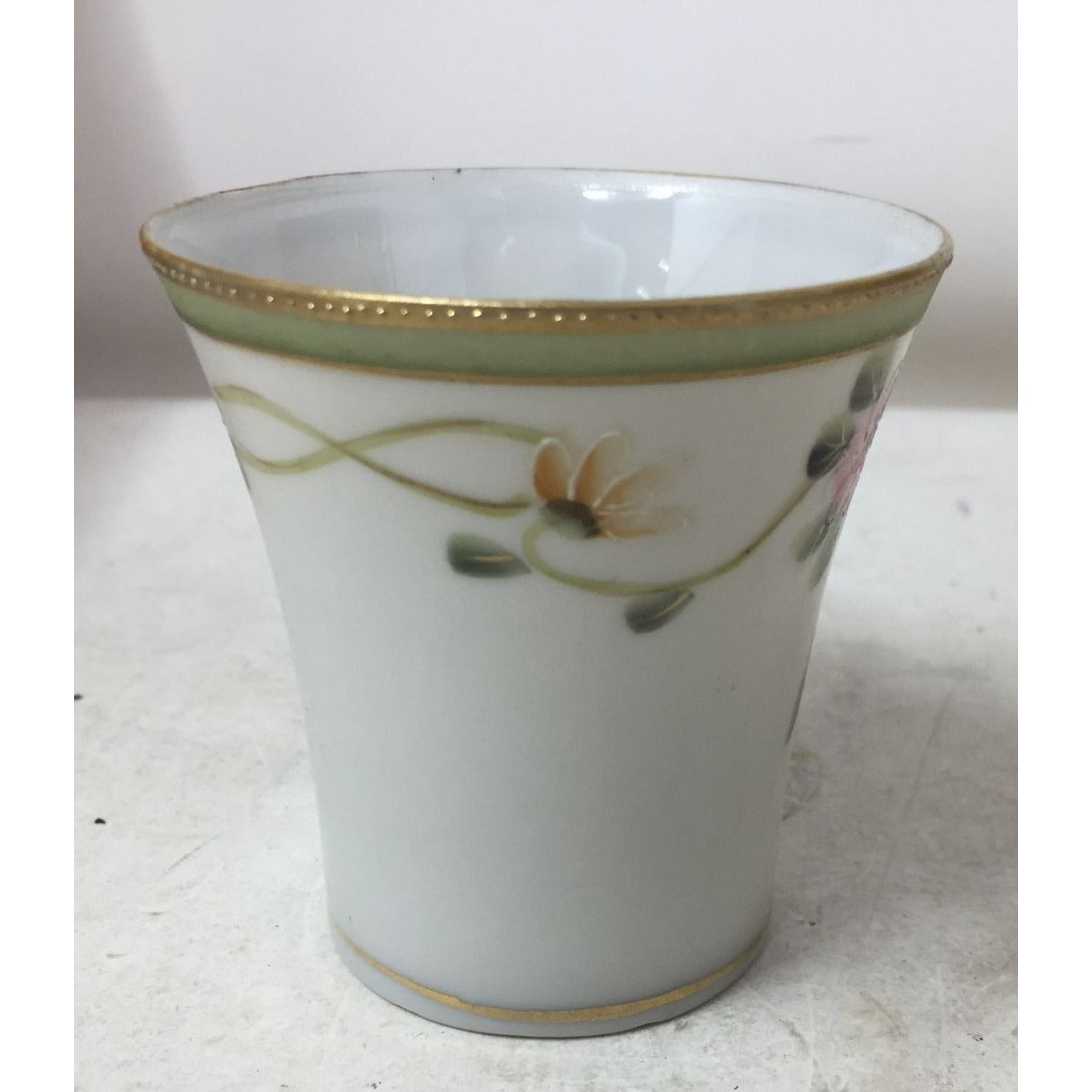 Small Handled Tea Cup with Floral Design and Gold /Green Rim