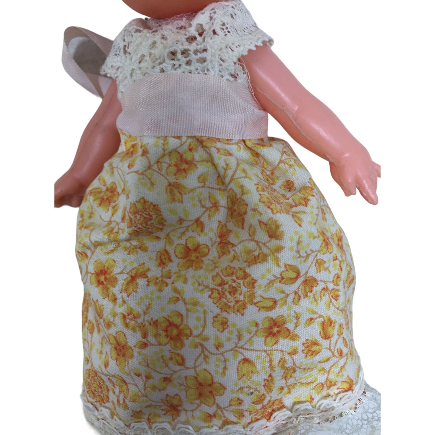 Vintage Collectible Small Baby Doll Brown Hair, Blue Eyes Wearing Yellow Floral Printed Dress