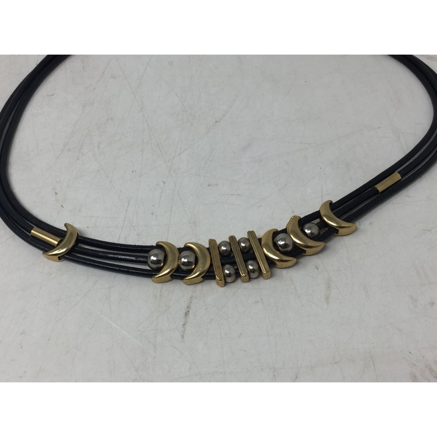 Women's Black Layered Rope Necklace with Gold and Silver Charms