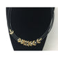 Women's Black Layered Rope Necklace with Gold and Silver Charms
