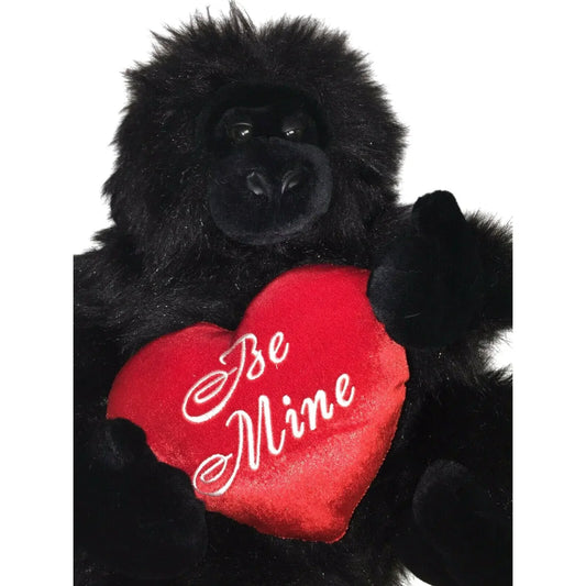 Plush black gorilla holding red heart pillow with 'Be Mine' text, gift for Valentine's Day