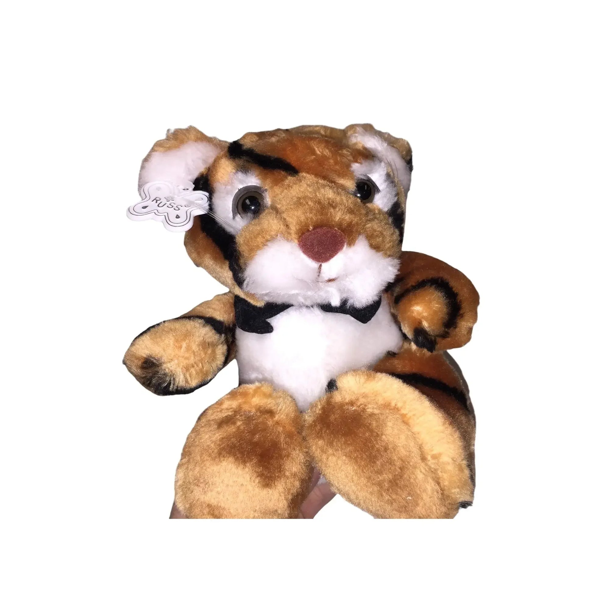 Plush tiger stuffed animal with soft brown fur, black stripes, and a bow tie on white background