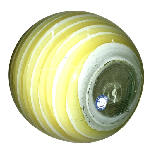 Round glass vase with yellow and white swirl stripes, glossy finish, seen from base