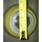 Yellow and white ceramic bowl measured with tape measure for diameter