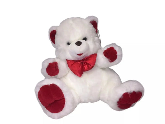 Plush white teddy bear with red ears, paws, and bow tie on a white background