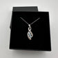 Blue Topaz Swirling Ribbon Necklace with Diamond Accent