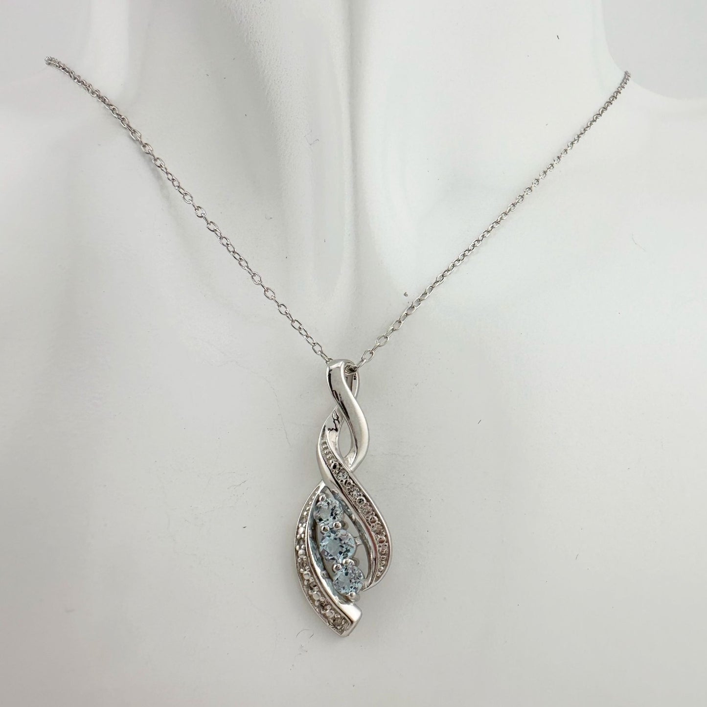 Blue Topaz Swirling Ribbon Necklace with Diamond Accent