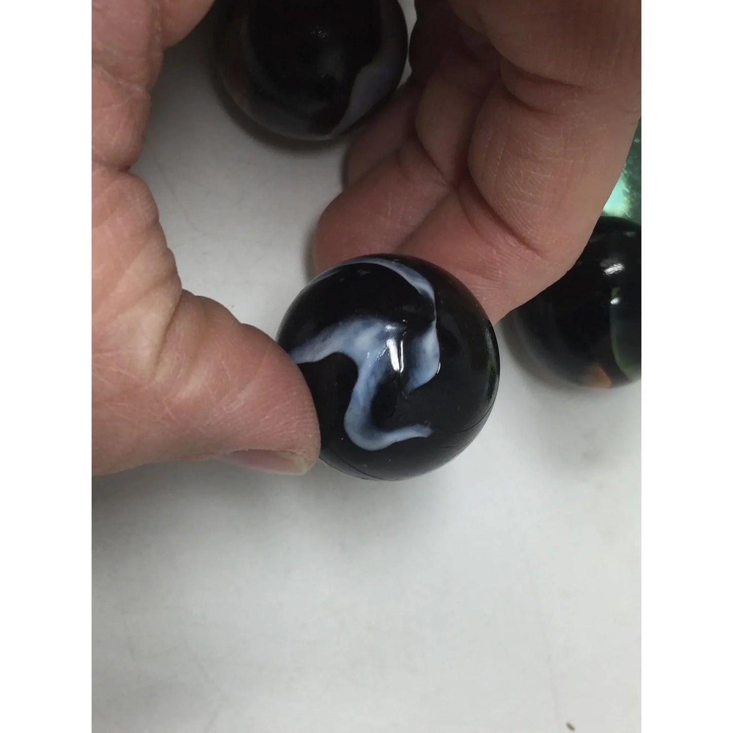 VINTAGE BLACK SHOOTER MARBLES WITH WHITE, YELLOW AND ORANGE SWIRLS - A+ Stuff - Collectibles - A+ Stuff