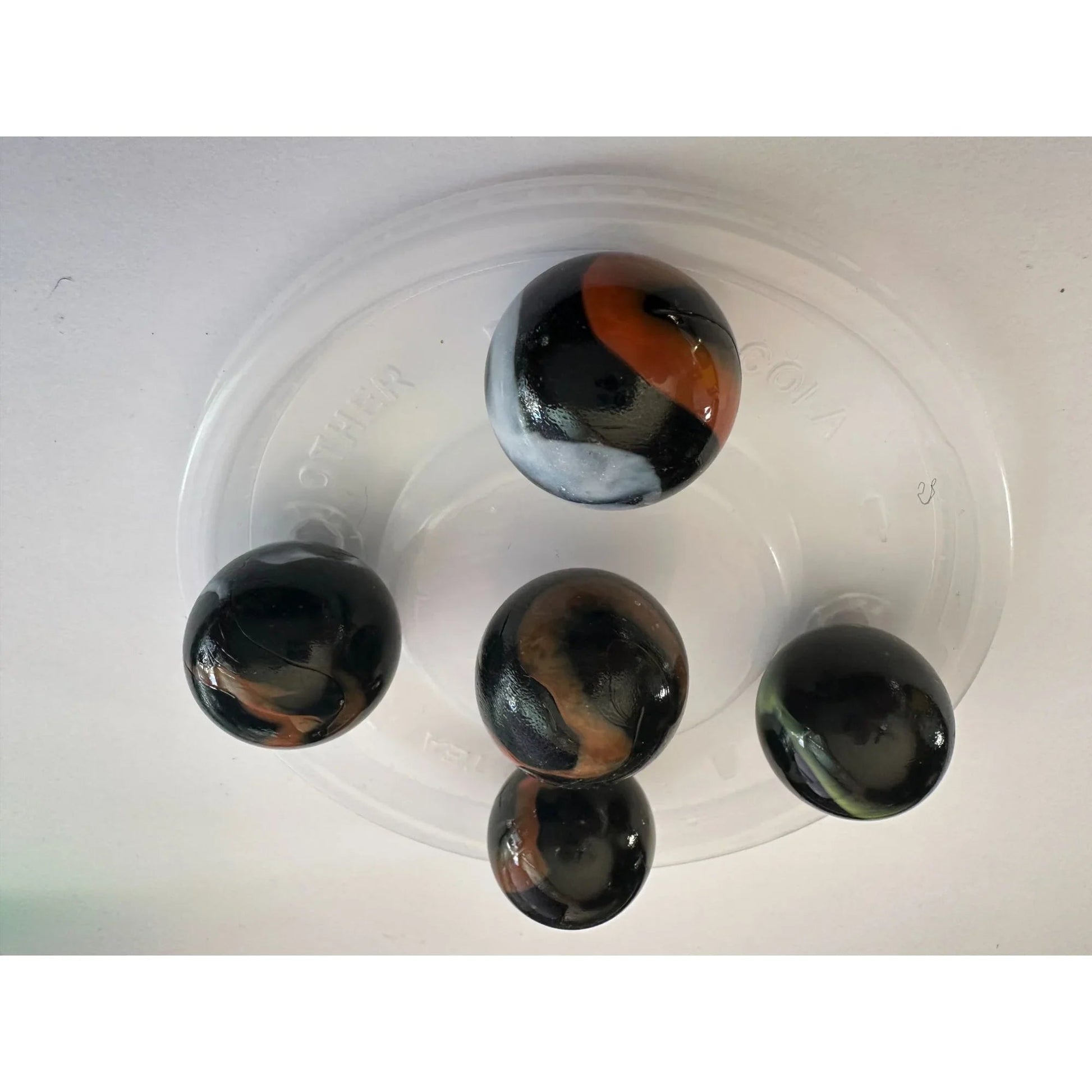 VINTAGE BLACK SHOOTER MARBLES WITH WHITE, YELLOW AND ORANGE SWIRLS - A+ Stuff - Collectibles - A+ Stuff