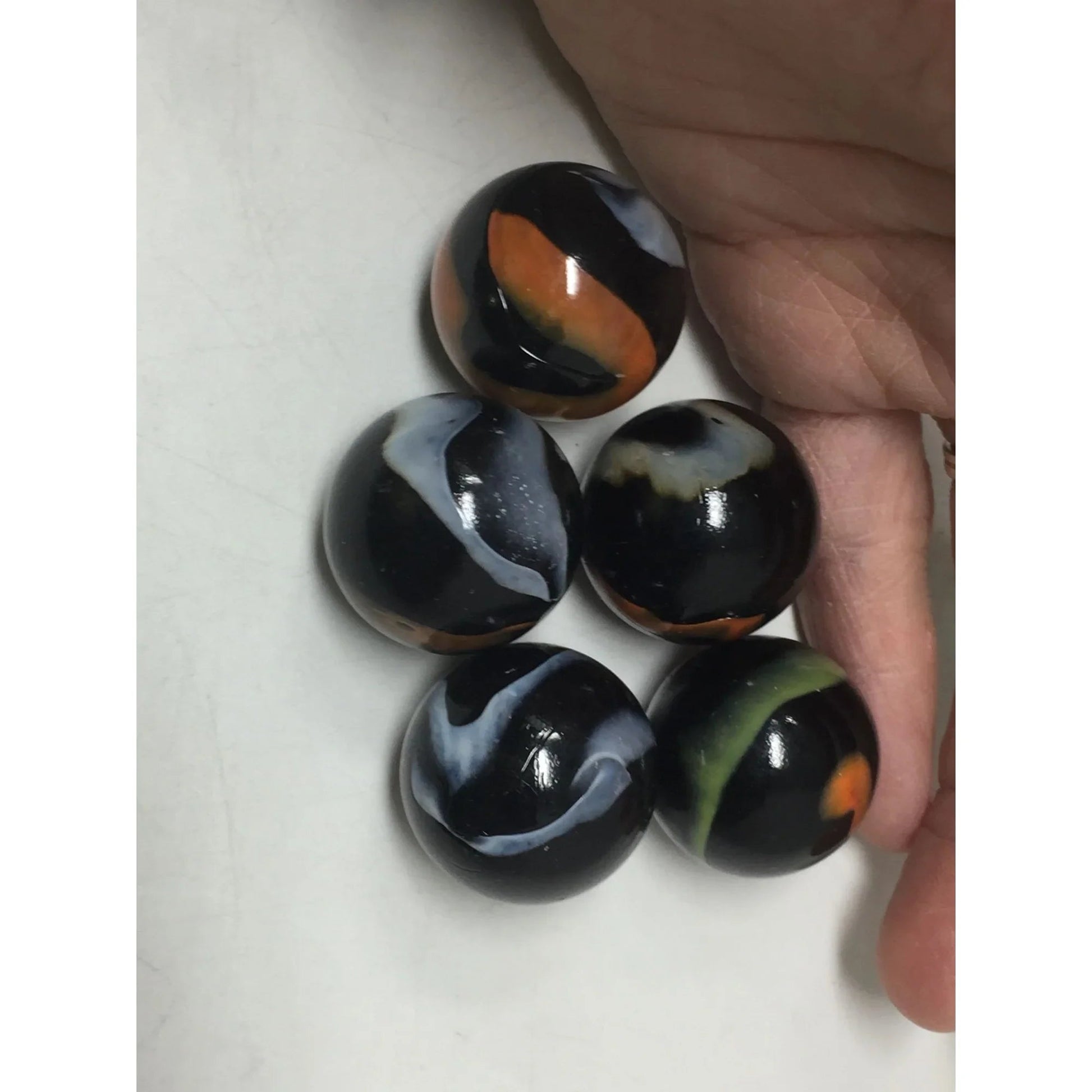 VINTAGE BLACK SHOOTER MARBLES WITH WHITE, YELLOW AND ORANGE SWIRLS - A+ Stuff - Collectibles - A+ Stuff