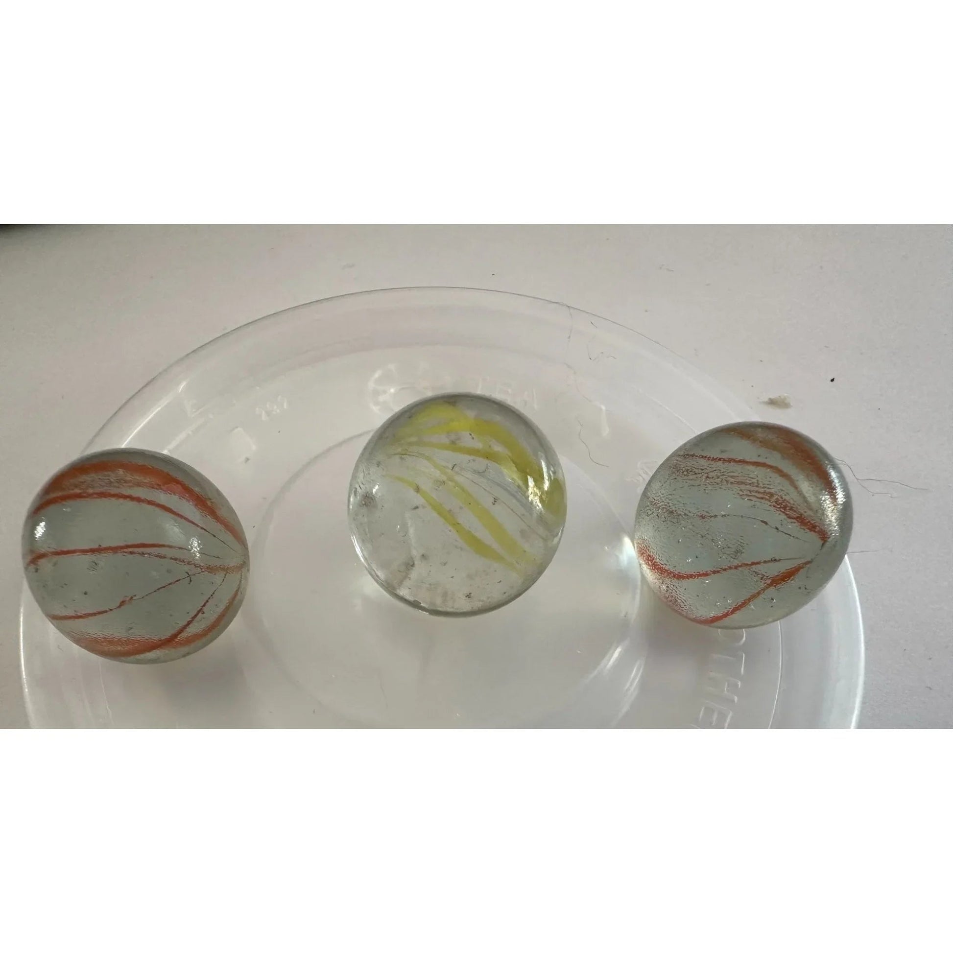 Vintage Clear Glass Shooter Marbles with Yellow and Orange Swirl Design - A+ Stuff - Collectibles - A+ Stuff