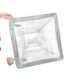 Hand holding a clear square glass container with smooth edges on a white background