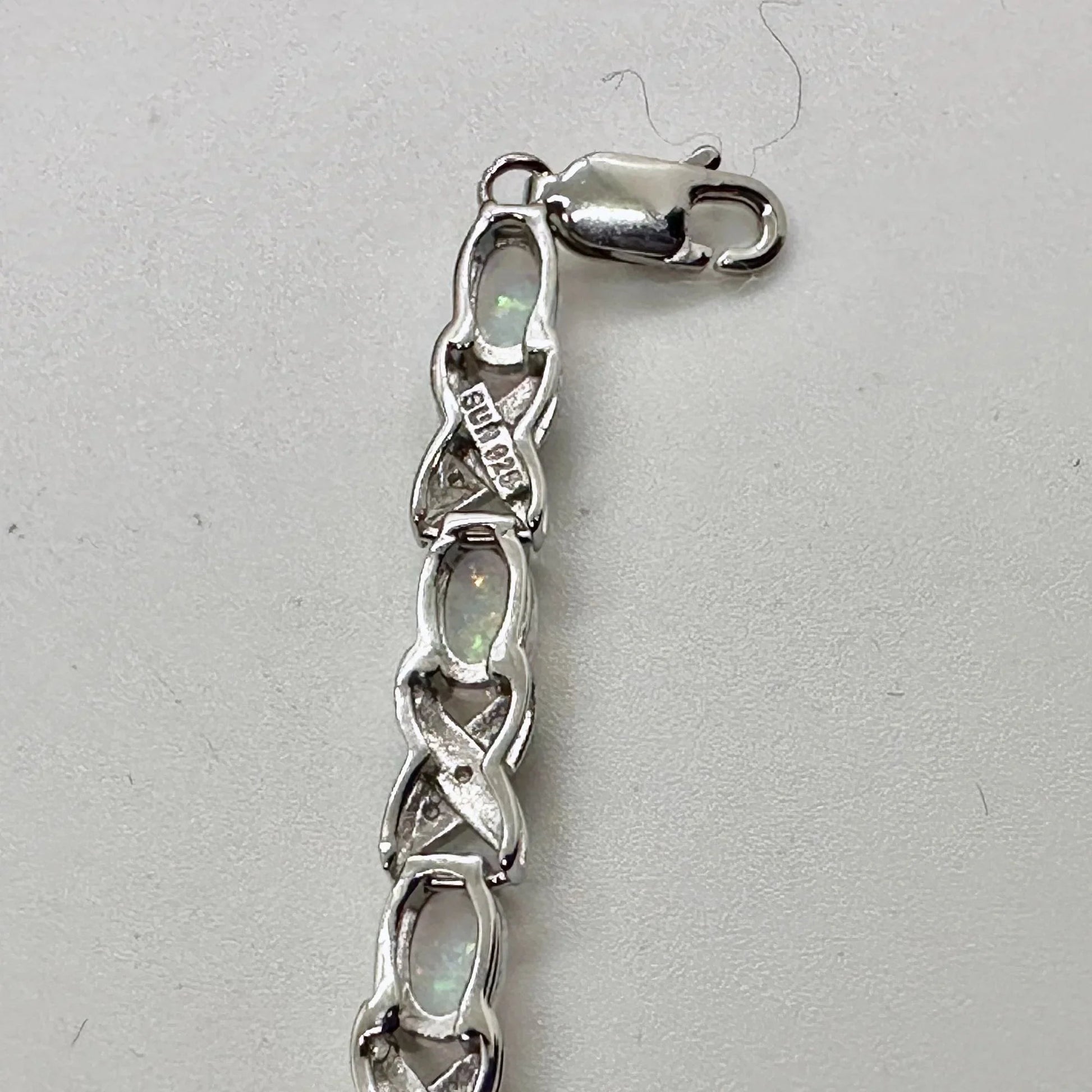 XO Infinity Bracelet Lab Created Opal and Diamond Accent in Sterling Silver Setting - Stunning Gemstones - A+ Stuff