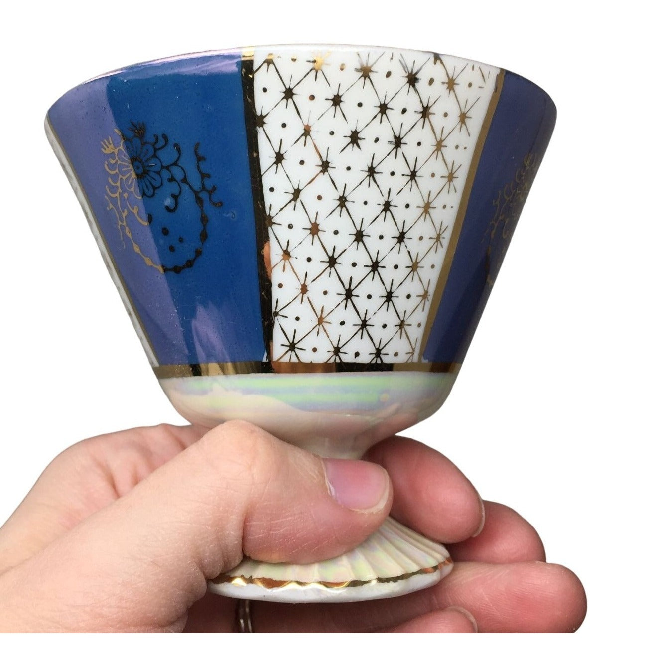 Blue and white Iridescent Teacup and Saucer Set with small gold accent pattern