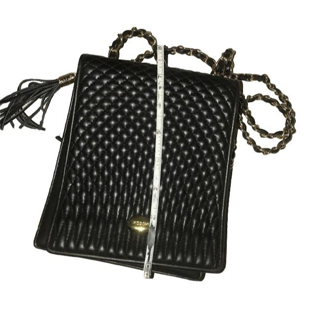 KOSHI - compact women's shoulder or crossbody bag - black textured purse with chain-looking strap - Black with brass hardware - tassels - Te