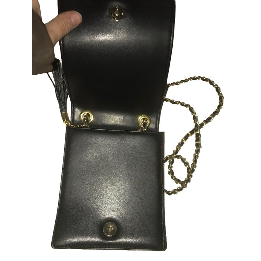 KOSHI - compact women's shoulder or crossbody bag - black textured purse with chain-looking strap - Black with brass hardware - tassels - Te