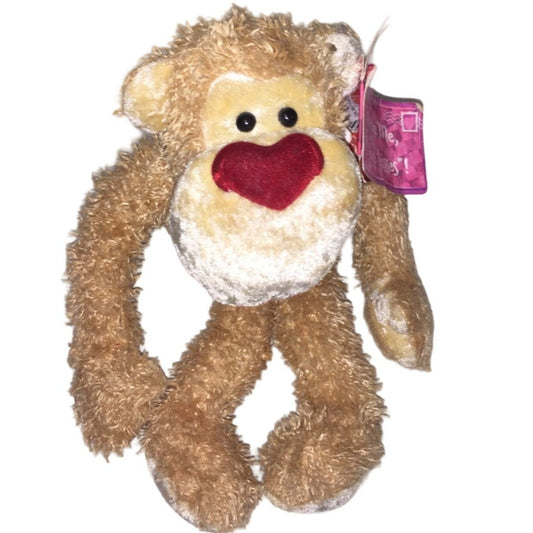 Cute DAKIN Plush Monkey with very large Heart shaped nose. Original Tags attached.