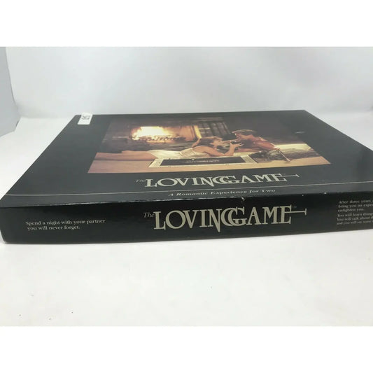 The Loving Game board game box, romantic gift for couples, featuring a cozy fireplace scene.