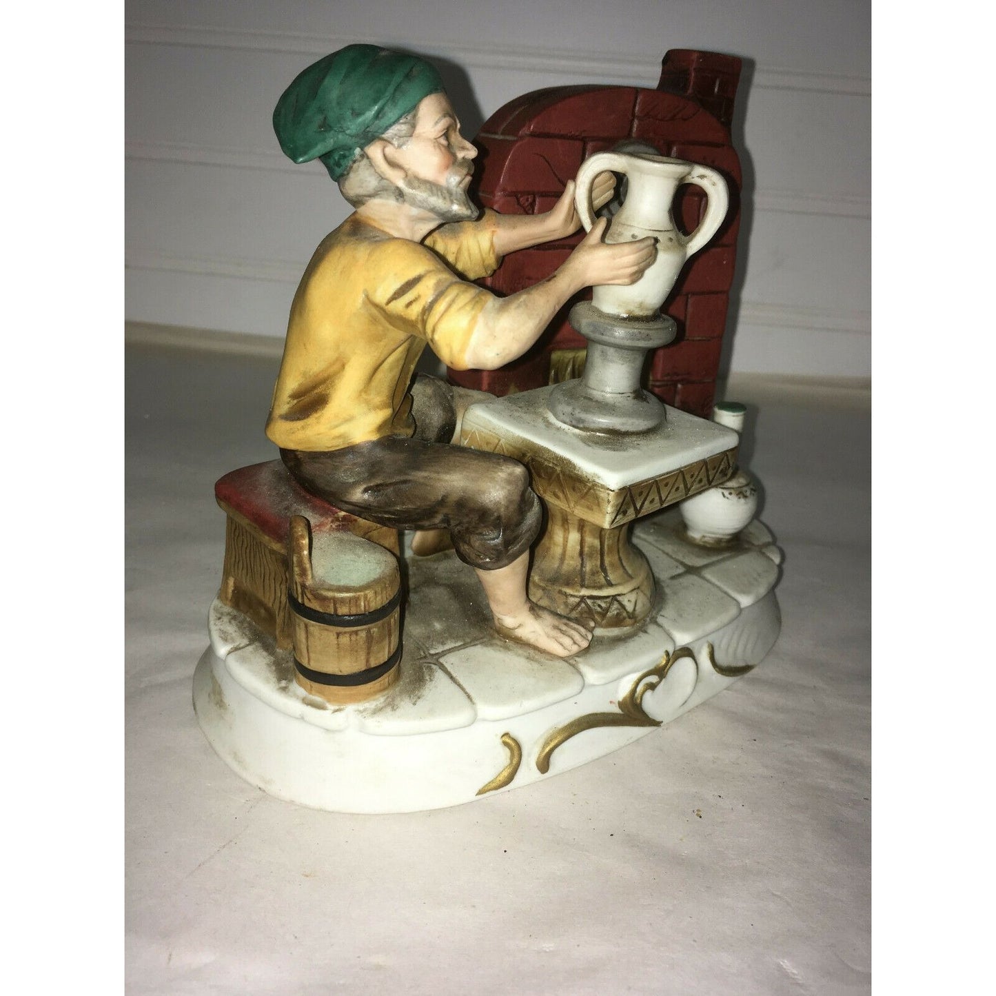 Vintage Potter with Hat on Barrel making Vase Porcelain Figurine