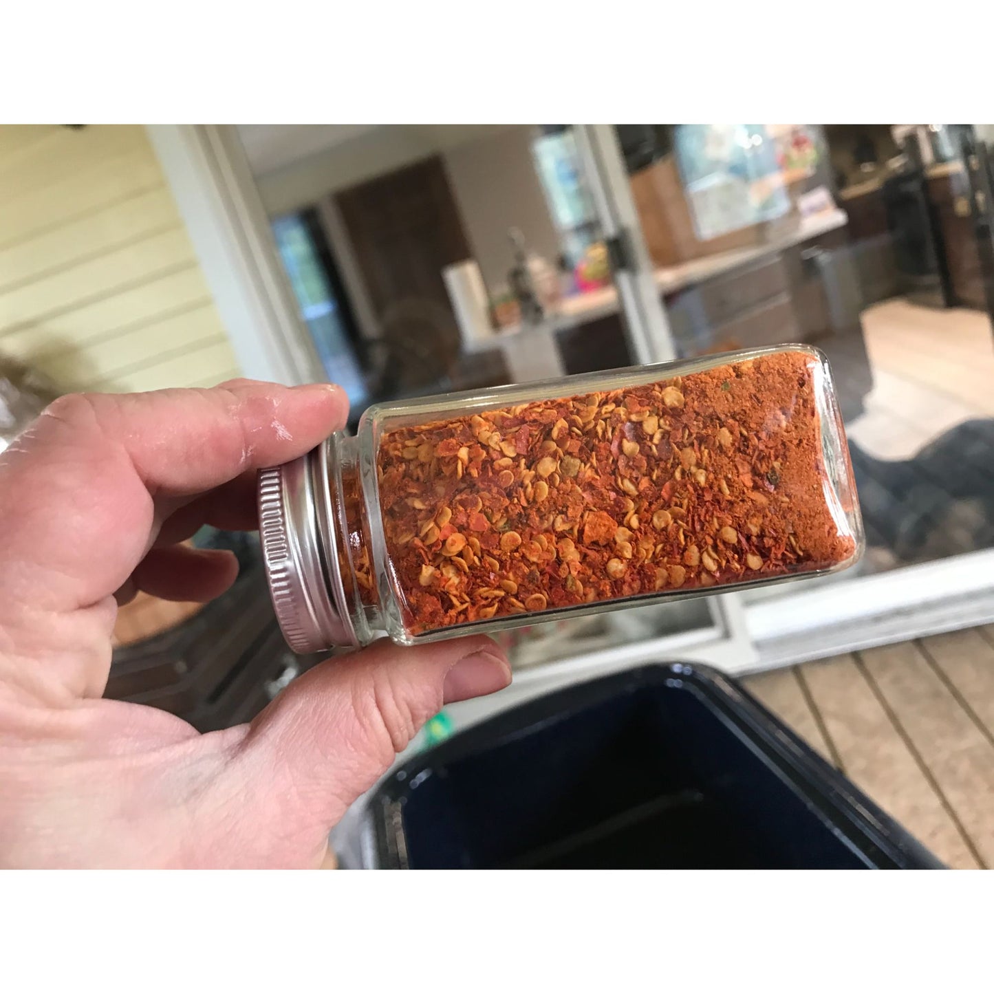 Dried and crushed Red Chili peppers to add a kick!  No other ingredients.