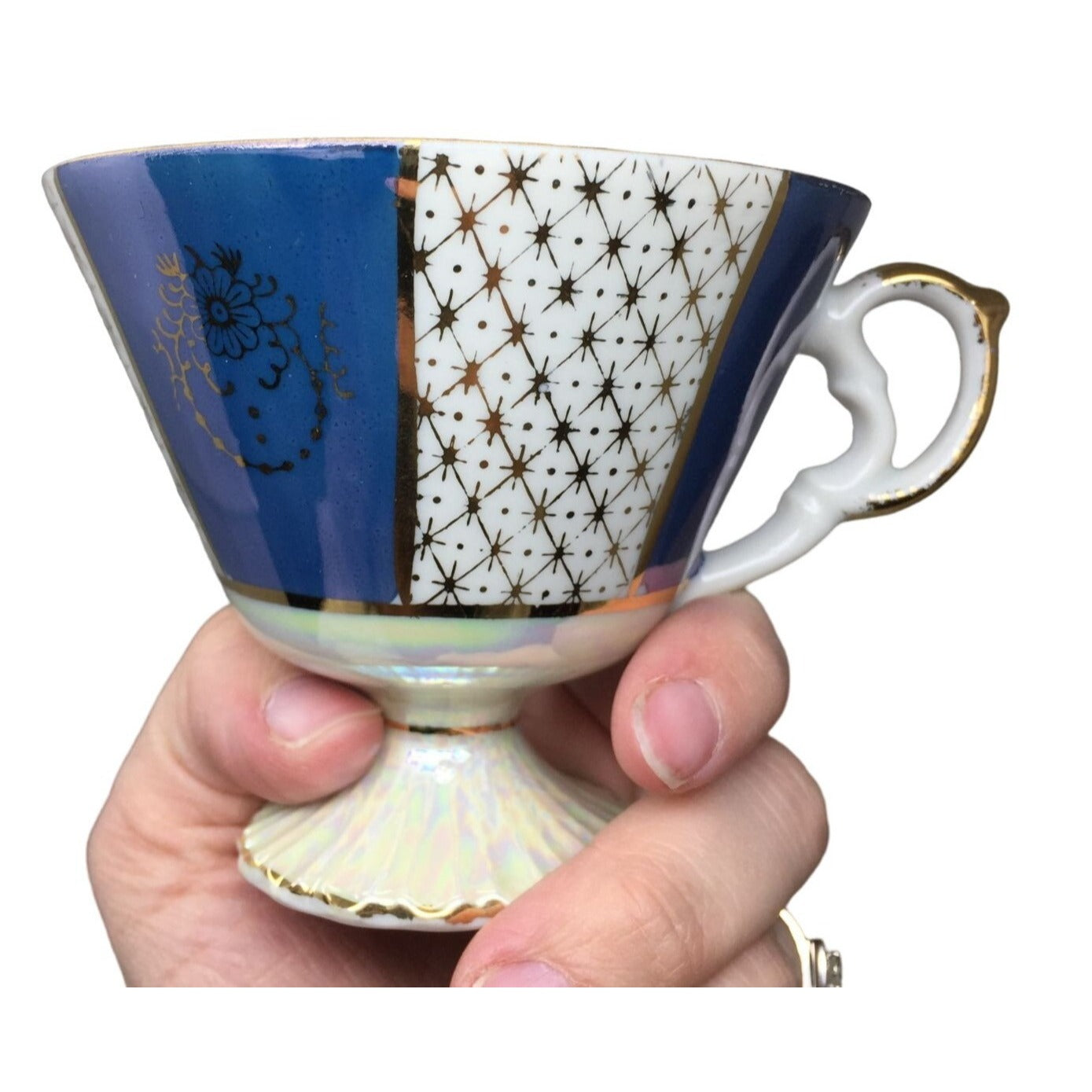 Blue and white Iridescent Teacup and Saucer Set with small gold accent pattern