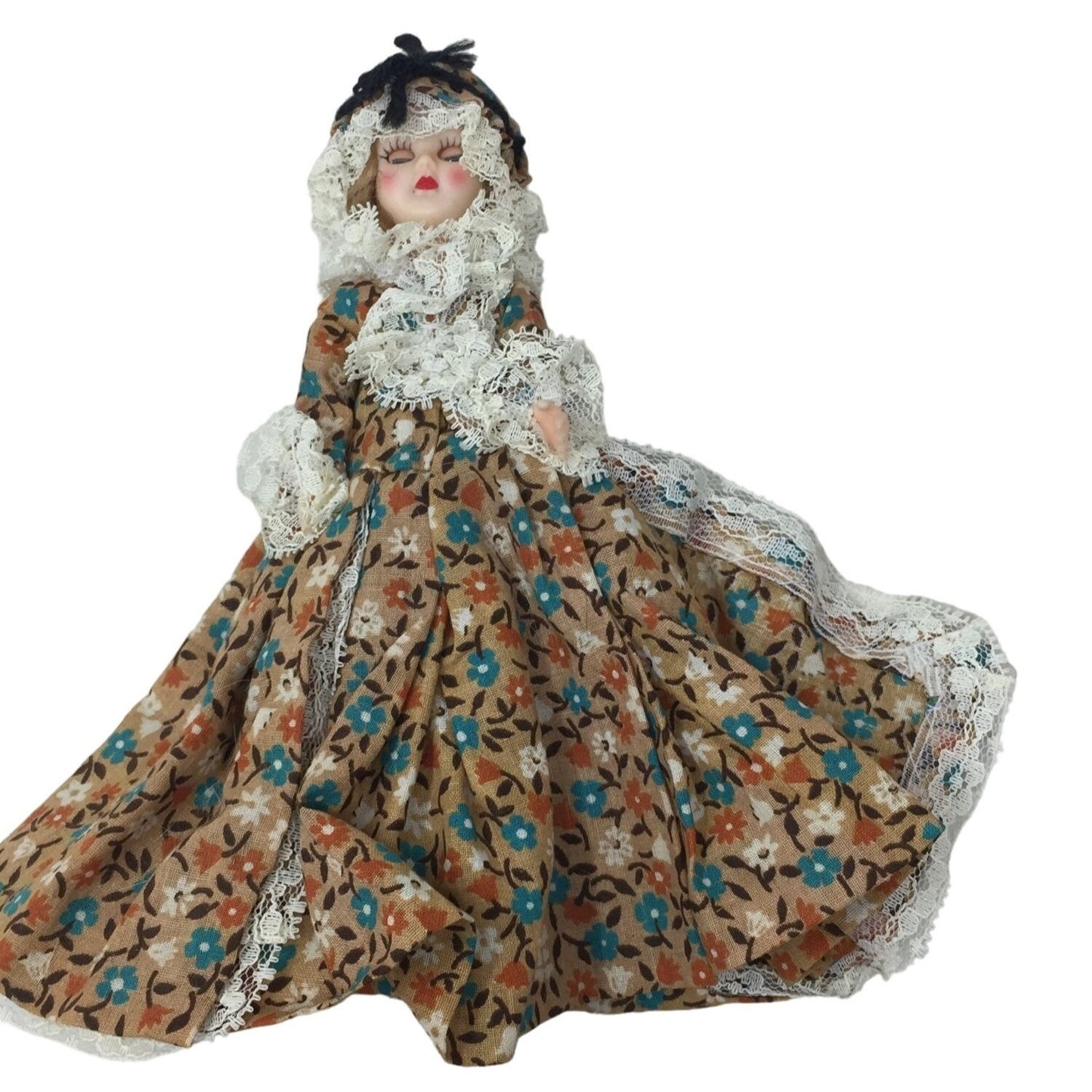 Vintage Black hair lace edged doll in brown floral print dress - eyes open and close